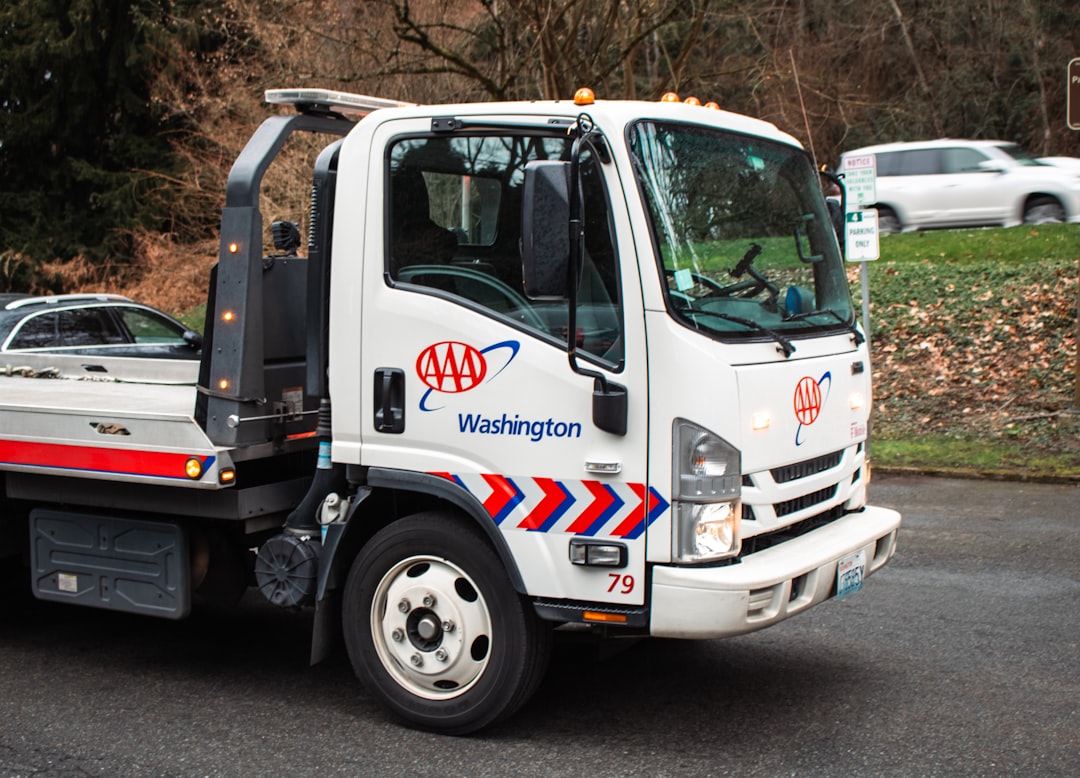 A white AAA tow truck.
